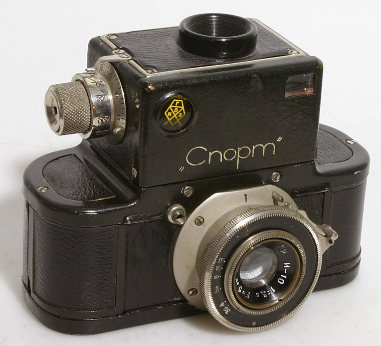 Camera 1.20 1. Зеркальный фотоаппарат спорт 1935. Фотоаппарат 1935 на 35 мм. Фотоаппарат лейка 1935 года. Первый зеркальный фотоаппарат Сэттона.