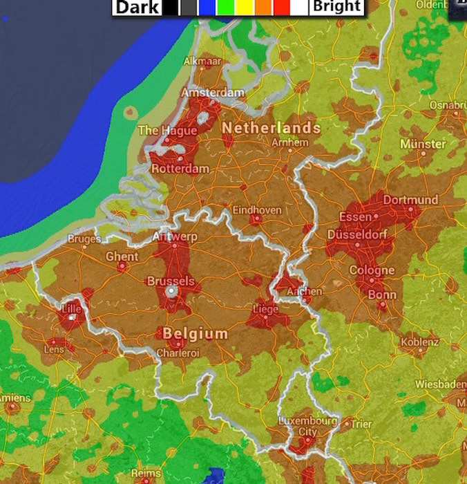 A light-pollution map for Belgium: brighter areas are in red while the darker ones are in black