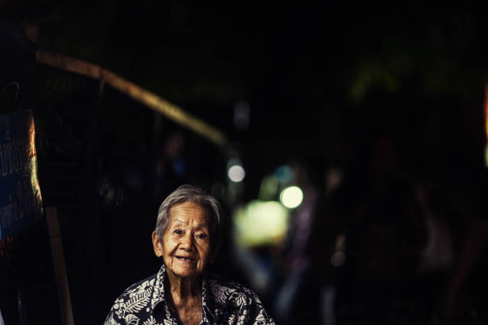 A night portrait of an elderly woman