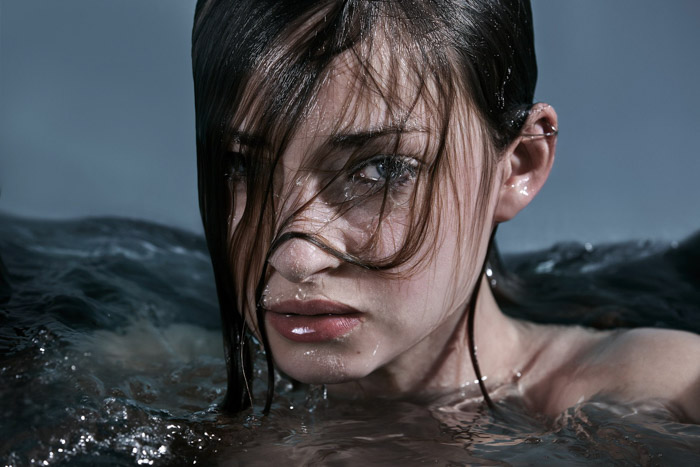 A portrait of a female model with her head above water. The second place winner of the Lens Culture portrait award 2017