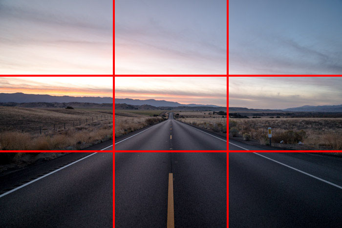 A countryside road scene at evening time, with the rule of thirds grid overlayed