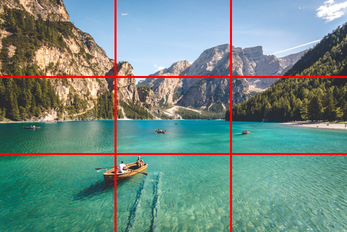 An image of a beautiful tropical coastal scene with the rule of thirds composition grid overlayed, the points of interest falling on the horizontal lines