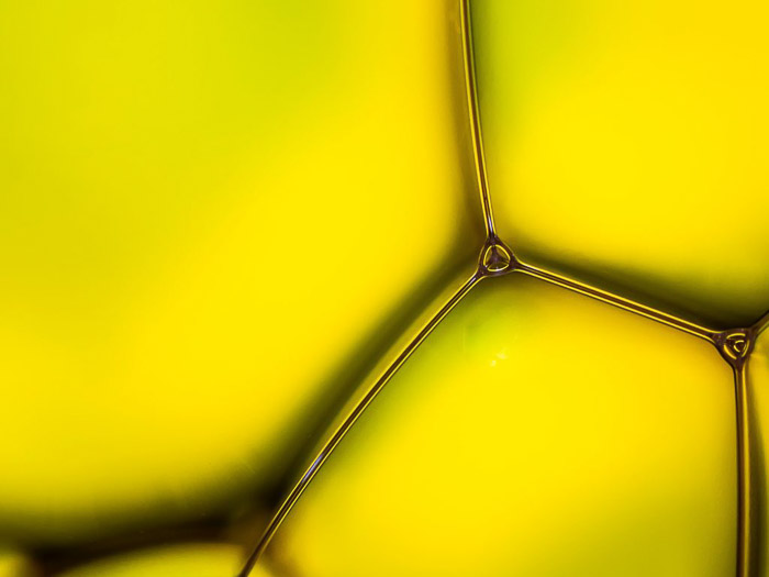 Abstract macro photography of yellow oil and water