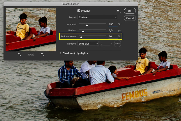 Screenshot of editing a picture in Photoshop showing a row boat in India. The Smart Sharpen setting are open in this screenshot. The Reduce Noise option is highlighted