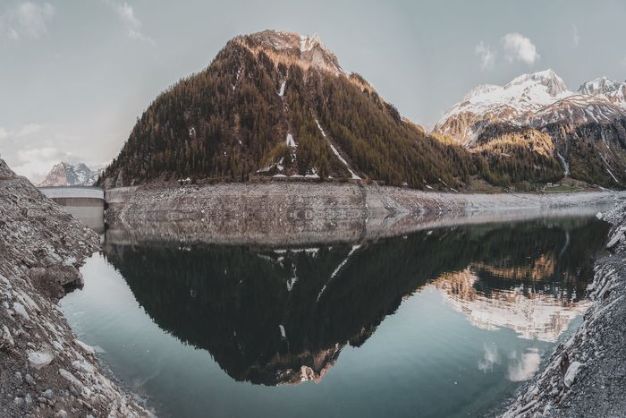 Photo of a mountain reflecting on a waterscape