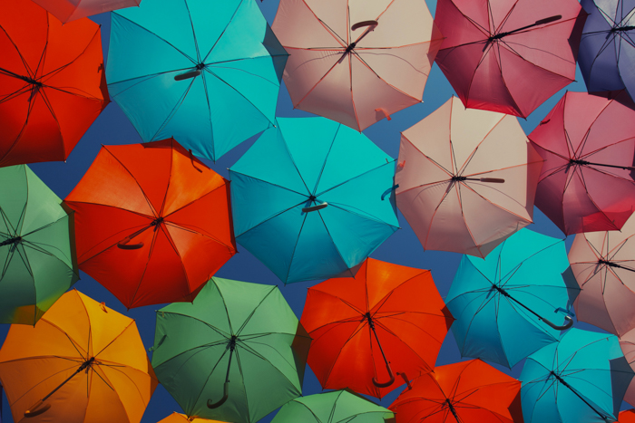 many umbrellas in different bright colors