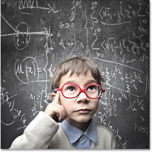 Thinking child with a blackboard in the background. Image licensed from Shutterstock by Photoshop Essentials.com