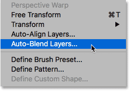 Selecting Auto-Blend Layers from under the Edit menu in Photoshop. 