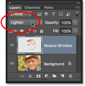 Changing the blend mode of the Reduce Wrinkles layer to Lighten. Image © 2016 Photoshop Essentials.com