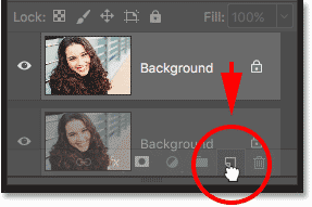 Dragging the Background layer onto the New Layer icon in the Layers panel in Photoshop