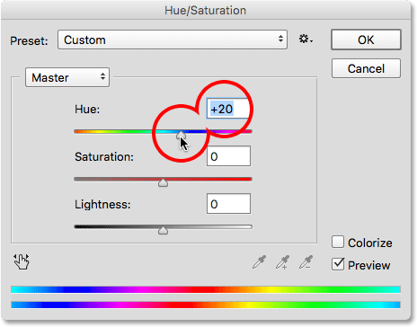 Dragging the Hue slider to adjust the colors in the lens flare. 