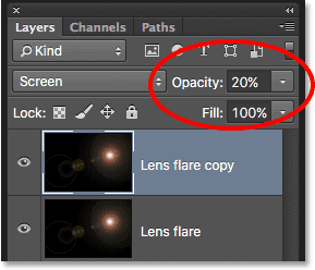Lowering the opacity of the Lens flare copy layer. 